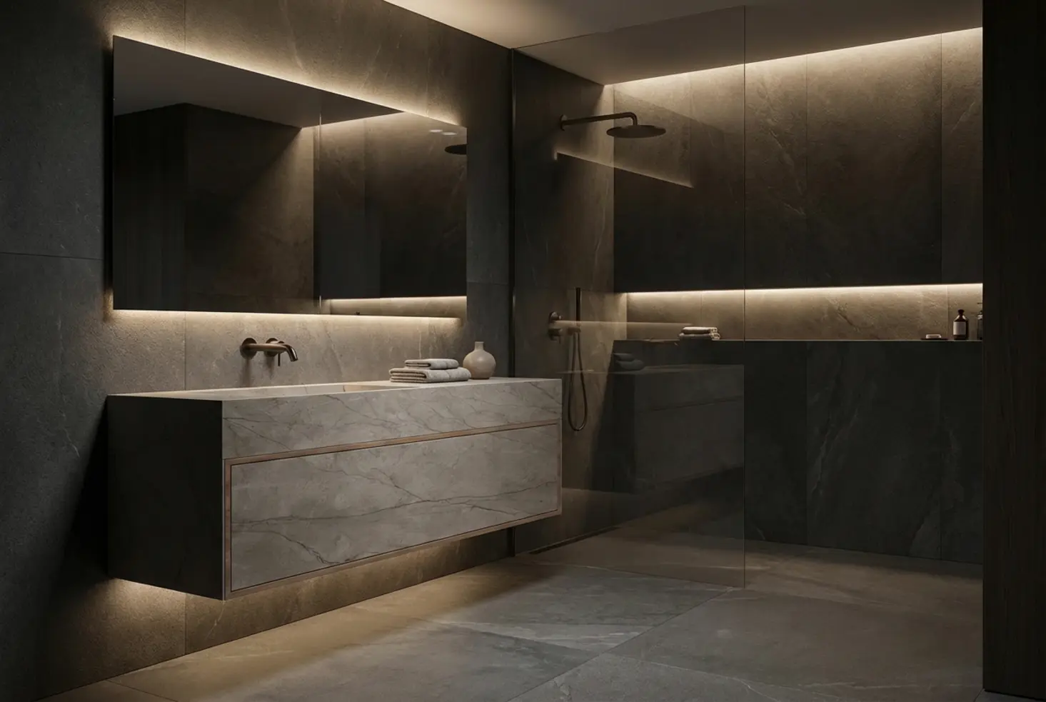 Encimera de baño flotante y paredes revestidas con Dekton en tonos grises veteados