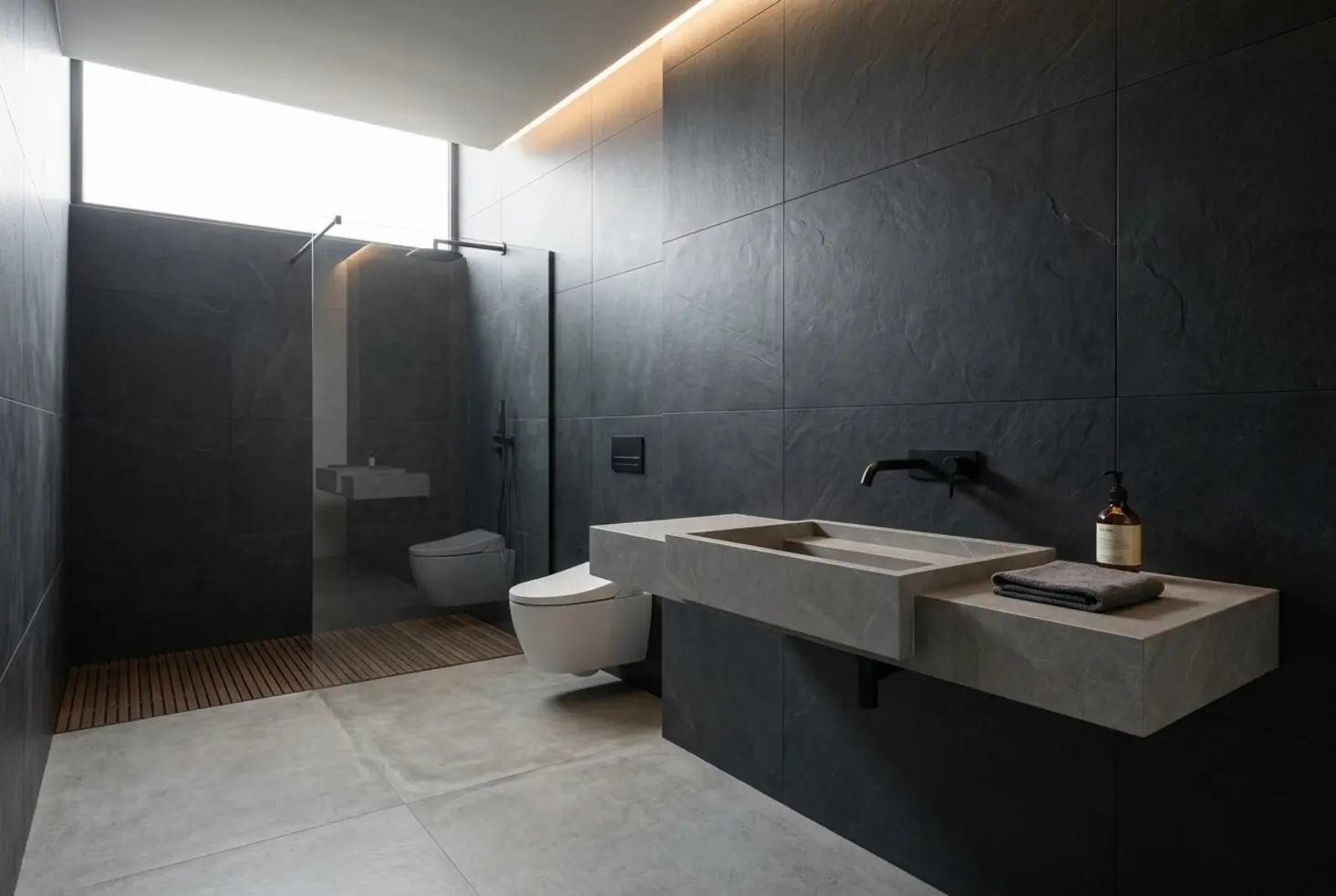 Lavabo suspendido de diseño minimalista en baño moderno con tonos oscuros